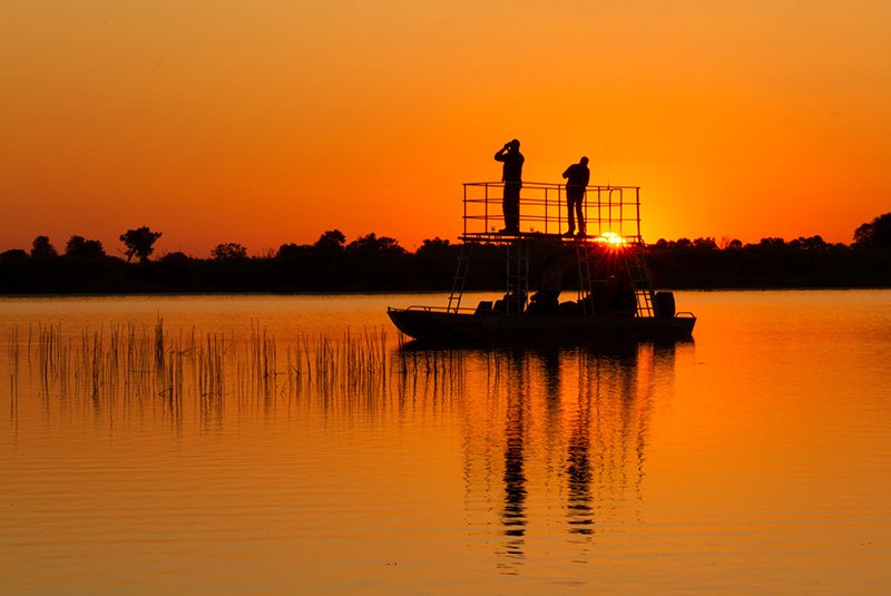 Boat cruise on the river at sunset